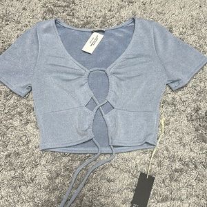 Blue cropped tie tee.